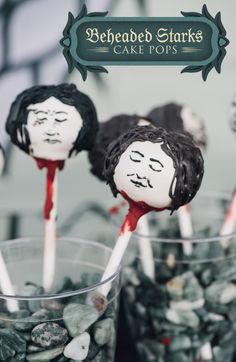 there are some cake pops that have been decorated to look like people with blood on them