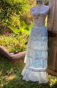 "a silk maxi skirt  in shades of pale blue hand dyed featuring some beautiful vintage pieces of embroidery and fine lace ruffles of patchworked silks and delicate linen gently flared  absolutely one of a kind  SIZE  ~ adaptable ~ when the drawstring waist is ungathered it measures 37\" /  length 41\" / mannequin is size small  cool gentle wash" Bohemian Long Skirt In Light Blue, Light Blue Long Bohemian Skirt, Bohemian Ruffled Skirt For Wedding, Blue Silk Skirt, Parachute Skirt, White Polka Dot Skirt, Printed Silk Skirt, Small Drawstring Bag, Skirt Outfits Fall