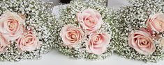 three bouquets of pink roses and baby's breath