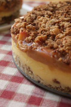 a close up of a pie on a table with red and white checkered cloth