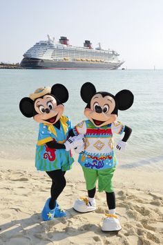 mickey and minnie mouse on the beach in front of a cruise ship at disney world