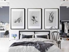 black and white bedroom with art on the wall