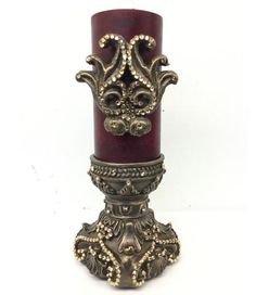 an ornate candle holder is shown on a white background