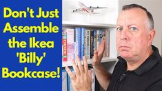 a man standing in front of a book shelf with books on it and the words don't just assemble the ikea billy bookcase