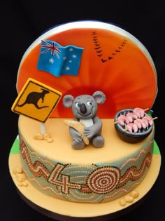 there is a cake decorated with an australian flag and koala