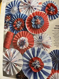 an open magazine with red, white and blue paper fans