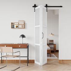 an empty room with a desk, chair and open door leading to the living area