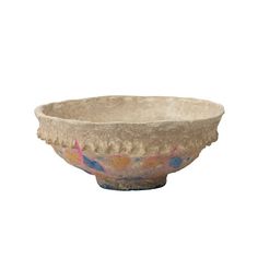 an old bowl is shown on a white background