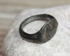 "These antique ring was found in the ground.  It is made from bronze in  10th - 12th century Items are uncleaned and has original patina of time. Size: -  1   -  12 mm   - 0.5 \" Thanks for your visit ! --------- DESCRIPTION: If you have any questions, please ask! ---------- PAYMENT POLICY: 1.) PayPal is accepted ---------- SHIPPING POLICY: 1.) International Shipping 2.) We are shipping via REGISTERED airmail. 3.) Items will be shipped on the same or next business day of receiving full payment. Bronze Engraved Medieval Jewelry, Handmade Medieval Brass Jewelry, Handmade Medieval Bronze Jewelry, Medieval Metal Jewelry With Antique Finish, Medieval Brass Jewelry With Antique Finish, Medieval Ring, Antique Rings Vintage, Medieval Rings, Rare Jewelry