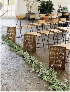 several wooden chairs lined up next to each other