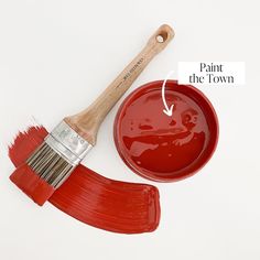 a paint brush and red bowl with the words paint the town on it's side