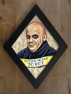 a wooden wall with a painting of a man on it's face and the words fester means to rot