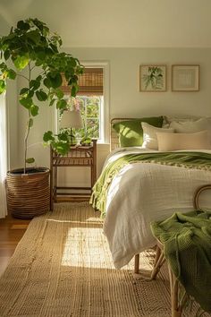 a bedroom with a bed, chair and potted plant