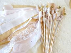 there are many different types of ribbons on the lace tablecloths, and one is white with gold accents