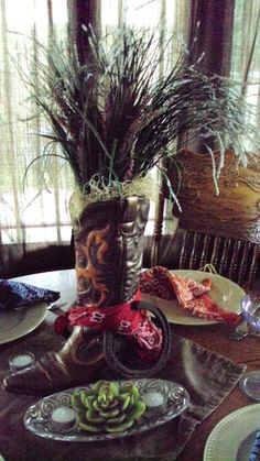 a dining room table with plates and vases on it