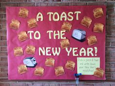 a toast to the new year bulletin board on a brick wall with magnets attached