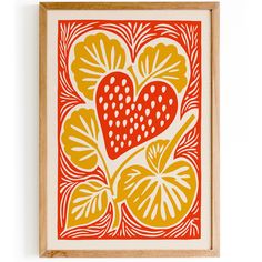 an orange and yellow print with hearts on it in a wooden frame hanging on the wall