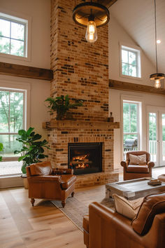 40 Elegant and Rustic Farmhouse Fireplace Ideas for Every Home Fireplace With Wood Storage Farmhouse, Red Brick And Shiplap Fireplace, Brick Fireplace High Ceiling, Faux Fireplace Brick, Brick Fireplace Floor To Ceiling, Tv Above Wood Burning Stove, Rustic Living Room Fireplace, Red Brick Fireplace Living Room, Farmhouse With Brick