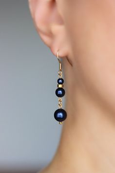 Lovely earrings with deep blue finest quality European pearl coated crystal beads (4,6,8 mm), gold tone beads separators and gold tone stainless steel earring hooks. *The total lenght of earrings is about 48 mm including earring hooks. Other earrings of my shop you can see here: https://www.etsy.com/shop/NaTavelli?section_id=13757927 Thanks for visit. Easy Bead Earrings, Blue Pearl Jewelry, Simple Bead Earrings, Crystal Bead Earrings, Blue Pearl Earrings, Dark Blue Earrings, Diy Earrings Easy