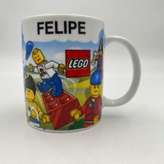 a coffee mug with the lego movie characters on it