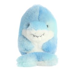 a blue and white stuffed animal with its eyes closed