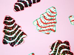 christmas tree shaped stickers on a pink background