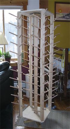 a tall wooden tower sitting in the middle of a living room