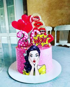 a birthday cake decorated with the number twenty five and balloons in the shape of lips