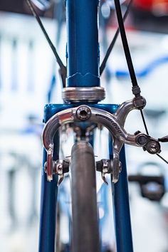 a closeup of bicycle brakes on a blue bicycle Bicycle Types, Pros And Cons, The Basics, Calipers, Different Types, To Learn, Cycling, Bicycle, Bike