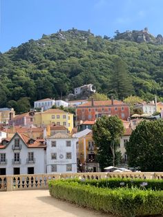 the city is surrounded by hills and trees