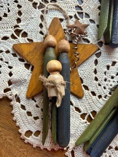 some wooden pegs are sitting on a doily