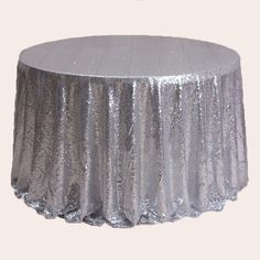 a silver sequin tablecloth on a white background