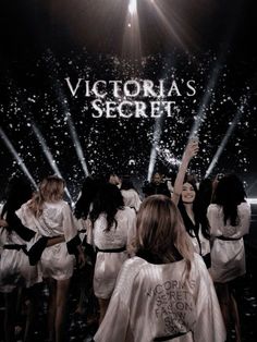 the victoria's secret show is being filmed on stage with people dressed in white