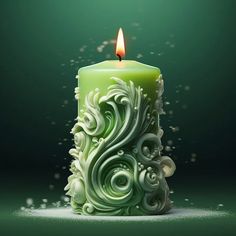 a green candle with white swirls and a lit candle on the side, in front of a dark background