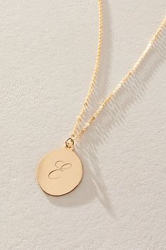 Just as effortless as it is elegant, this stunning necklace features an oval pendant with gorgeous cursive engraved initial for the ideal finishing touch. * 14k Gold Filled chain * Personalized, laser engraved, 14k Gold Filled 17x22mm oval pendant * Length: 20" * 5 days of production | Set & Stones Personalized Amelia Necklace at Free People in Gold Elegant Wedding Initial Necklace, Elegant Oval Charm Necklaces For Anniversary, Elegant Oval Pendant Charm Necklaces For Anniversary, Elegant 14k Gold Charm Necklace With Oval Pendant, Elegant 14k Gold Oval Pendant Charm Necklaces, Elegant Personalized Initial Necklace For Formal Occasions, Elegant 14k Gold Oval Pendant Charm Necklace, Polished Initial Pendant Necklace For Gift, Gift Initial Pendant Necklace With Polished Finish