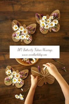 someone cutting out paper flowers on top of a wooden table with the words diy butterfly nature weavings