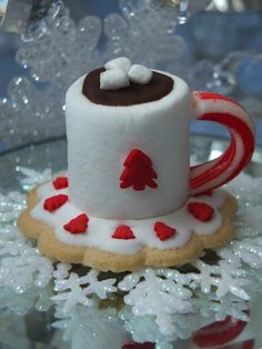 a hot cocoa marshmallow cookie on a glass plate