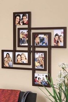 a bunch of pictures hanging on the wall above a vase with some flowers in it