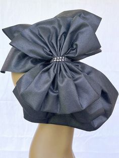 Embrace the essence of glamour with our exquisite 3 layer black bows, beautifully crafted with a 13in x 12in bottom black bow,  10in x 10in middle black bow and a chic 10in x 8in black bow artfully layered on top.  This captivating combination exudes elegance and allure, perfect for making a bold fashion statement.  Secured with a shimmering silver rhinestone closure, the design adds a touch of luxury to the ensemble.  Comfortably nestled on a 13in x 3/4in headband, our exclusive bows are though Elegant Bow With Black Ribbon, Elegant Black Bow With Tie Back, Adjustable Formal Bow, Elegant Formal Fascinator With Satin Bow, Black Wedding Bow Tie With Adjustable Back, Black Wedding Bow With Tie Back, Elegant Black Bow For Wedding, Chic Evening Bow With Detachable Feature, Elegant Black Wedding Bow