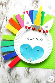 a paper plate with a unicorn face on it