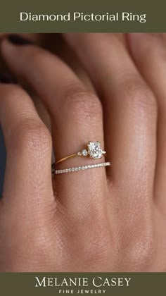 a woman's hand with a diamond ring on top of her finger and an engagement band