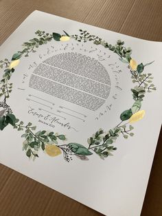 a wedding certificate with lemons and greenery around it on top of a piece of paper