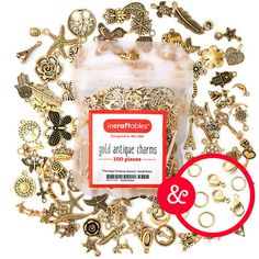 an assortment of gold and silver charms with a red rubber stamp on the bottom that says,