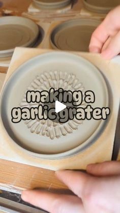 someone is making a ceramic plate with the words making a garifiater on it