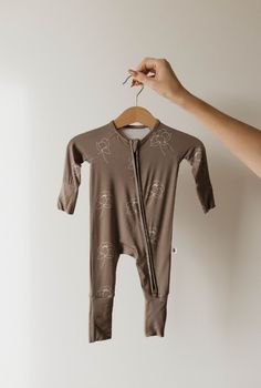 Made of the softest premium bamboo. Durable and well designed your little ones can sleep and play in these cozy pajamas. Our smallest sizes have rollover cuffs on the hands and all of the one piece sizes have cuffs on the feet giving you the option to go footless or footed without changing outfits.  Sizes available in newborn - 24 months Material : 95% bamboo viscose / 5% spandex Care Instructions : Wash with like colorsTumble dry on low or hang dry Baby Bow Hats, Baby Bamboo, French Baby, Baby Sleep Sack, Nursing Wear, Going Home Outfit, Wooden Hanger, Bamboo Pajamas, Cozy Pajamas