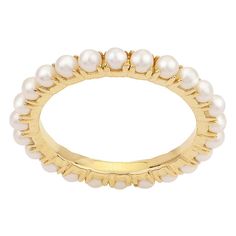 a gold ring with pearls on it