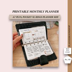 an image of a planner on a table with the words printable monthly planner