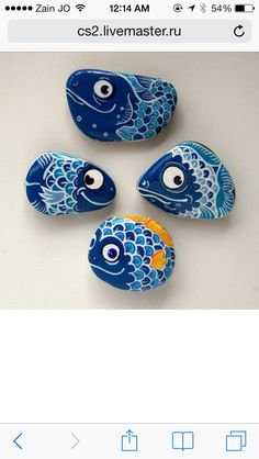 four blue and yellow fish rocks with eyes on them, sitting next to each other