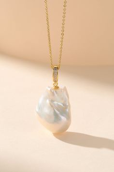 Elevate your jewelry collection with our sophisticated Large White Baroque Pearl Pendant Necklace. This exquisite piece showcases a lustrous white baroque pearl, generously sized at 13-15mm, renowned for its brilliant sheen. The versatile design features a universal detachable clasp, allowing the pendant to be easily transferred and styled with various chains. Complemented by a sleek silver chain of 40cm with an additional 5cm extension, this necklace offers elegance that transitions effortlessl Luxury Brass Pearl Pendant Jewelry, Pearl House, Baroque Pearl Pendant, Golden South Sea Pearls, Mabe Pearl, Pearl Jewelry Necklace, Baroque Pearl Necklace, Purple Pearl, Pearl Necklaces