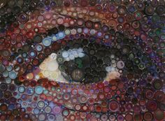 an eye made out of many different colored bottles and caps on the bottom half of it